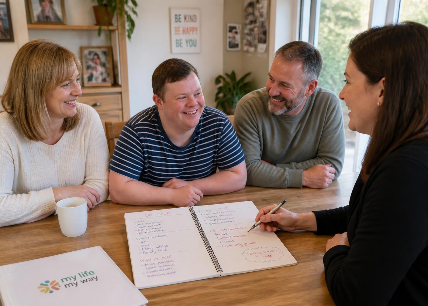 A family and support coordinator planning goals together with a young adult with a disability.